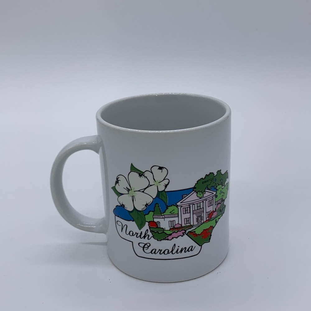 Vtg. Raleigh NC. 12 Oz Ceramic Souvenir Mug Representing State Dogwood & Capital